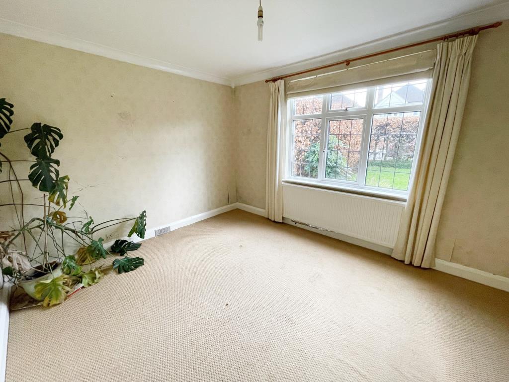 Lot: 63 - A DETACHED THREE-BEDROOM HOUSE SITUATED IN A POPULAR LOCATION FOR IMPROVEMENT - front reception room with window to front garden